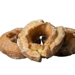 Cake doughnut fried and dipped in vanilla icing glaze