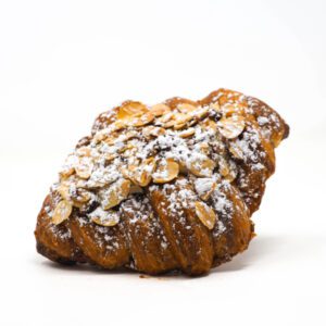 Our classic croissant sliced in half and filled with a layer of jam and almond cream and topped with toasted almonds